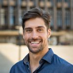 Smiling man with beard feeling confident.
